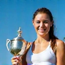 Smiling tennis player holding a trophy