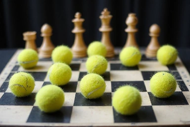 Chess board with tennis balls